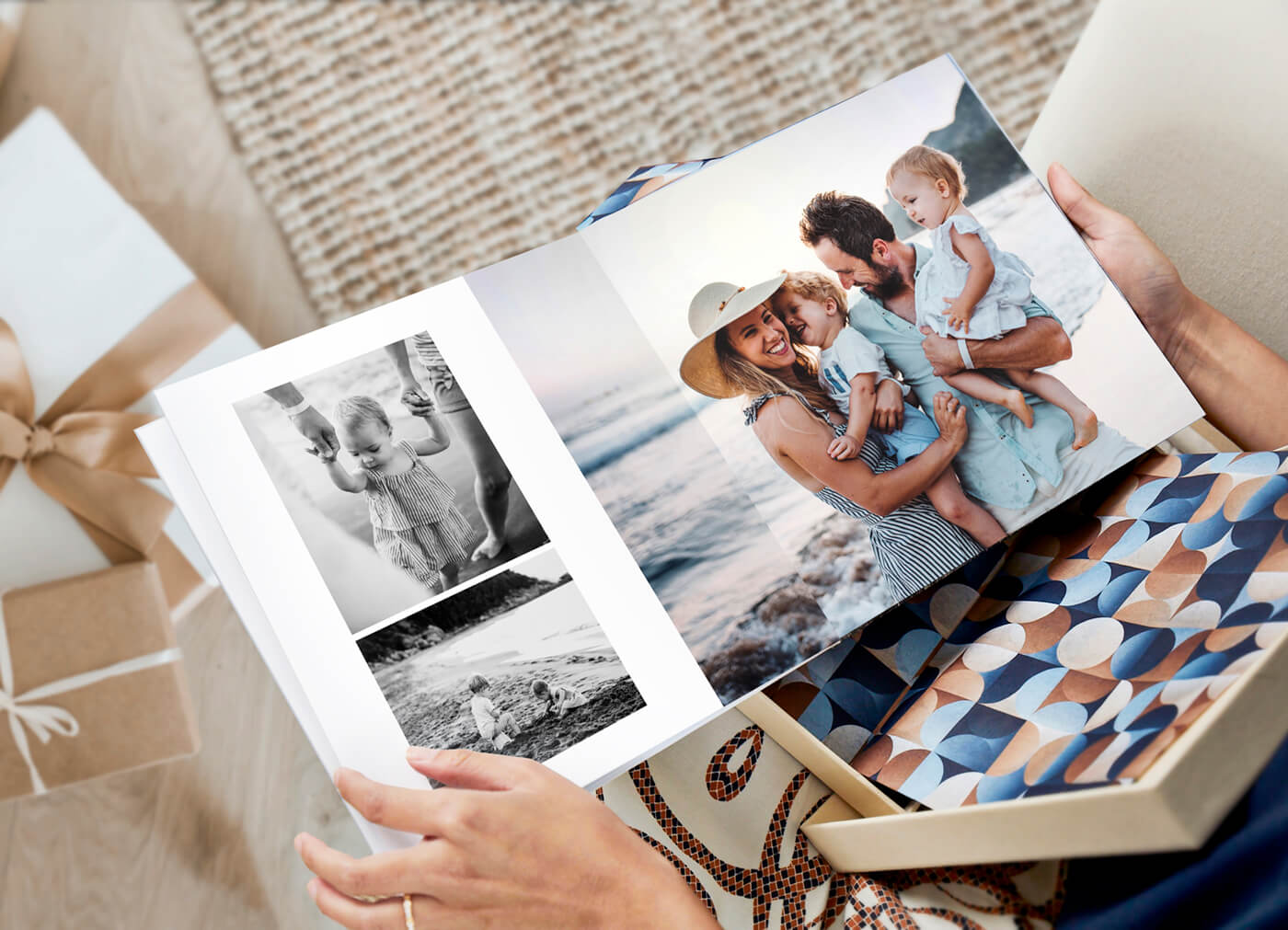 woman looking through a photo book by printique