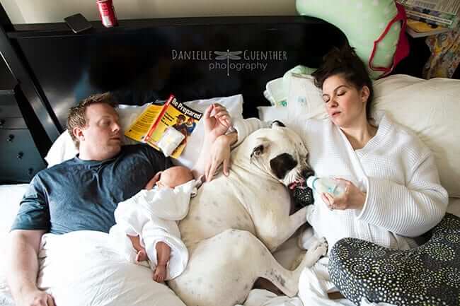 Tired Young Family in Bed