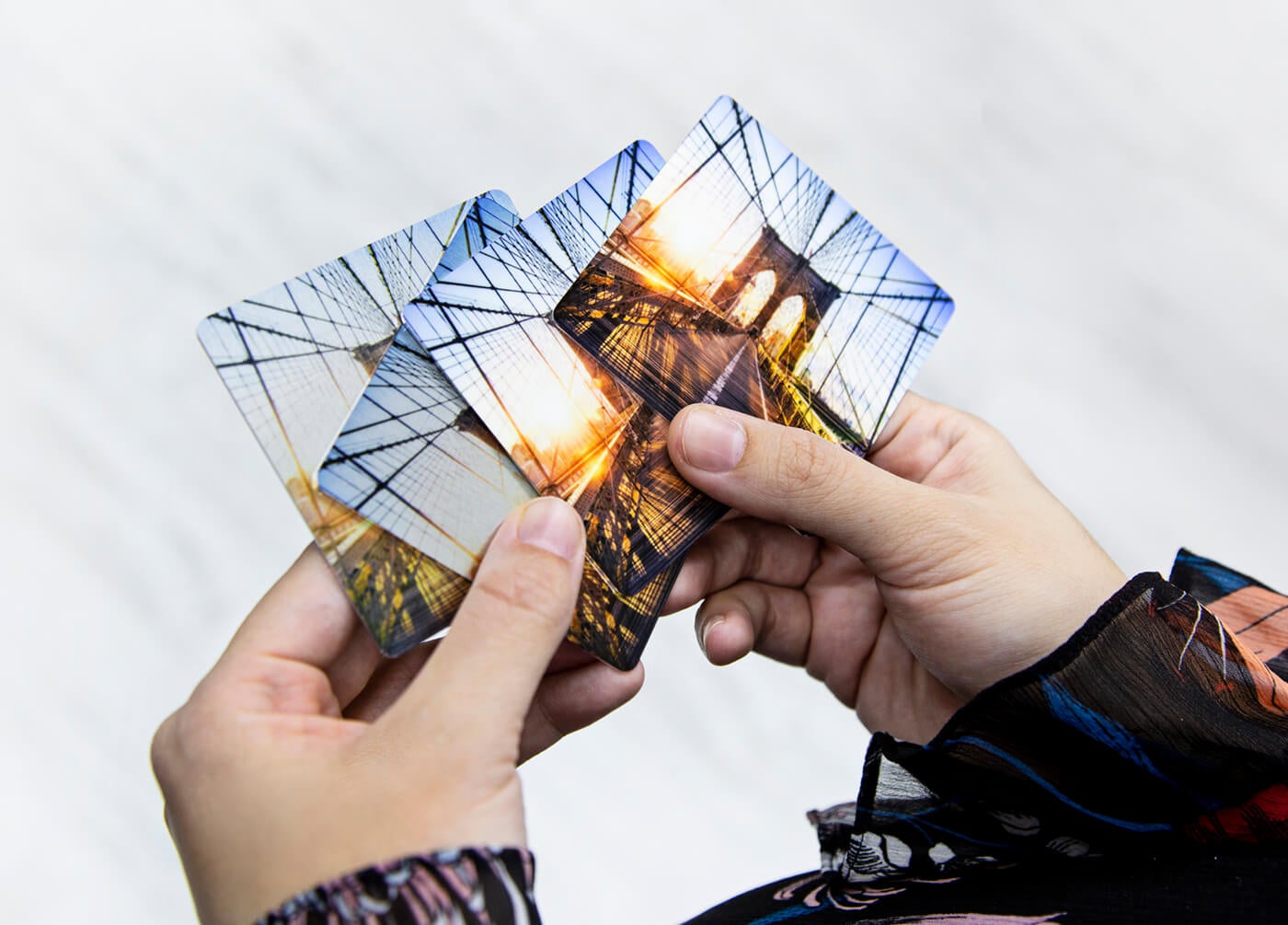 person holding metal samples manufactured by printique