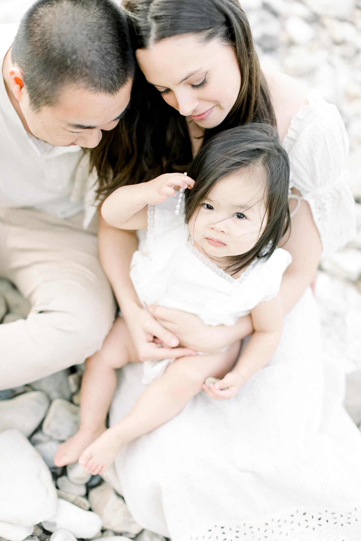 family sitting for beach portrait