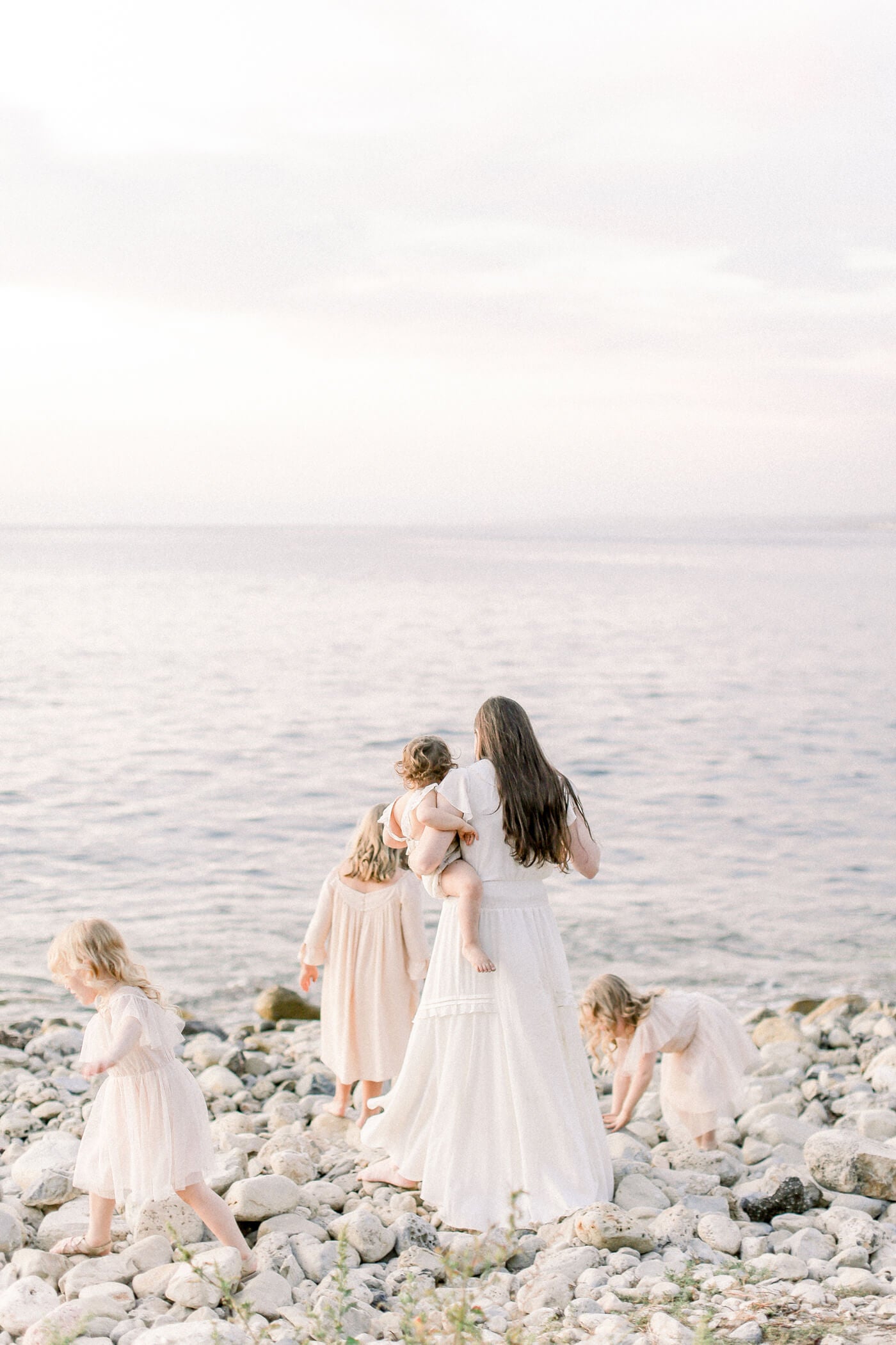 family on sand for beach portraits